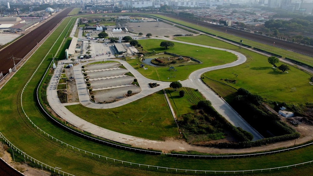 an aerial view of a large green field