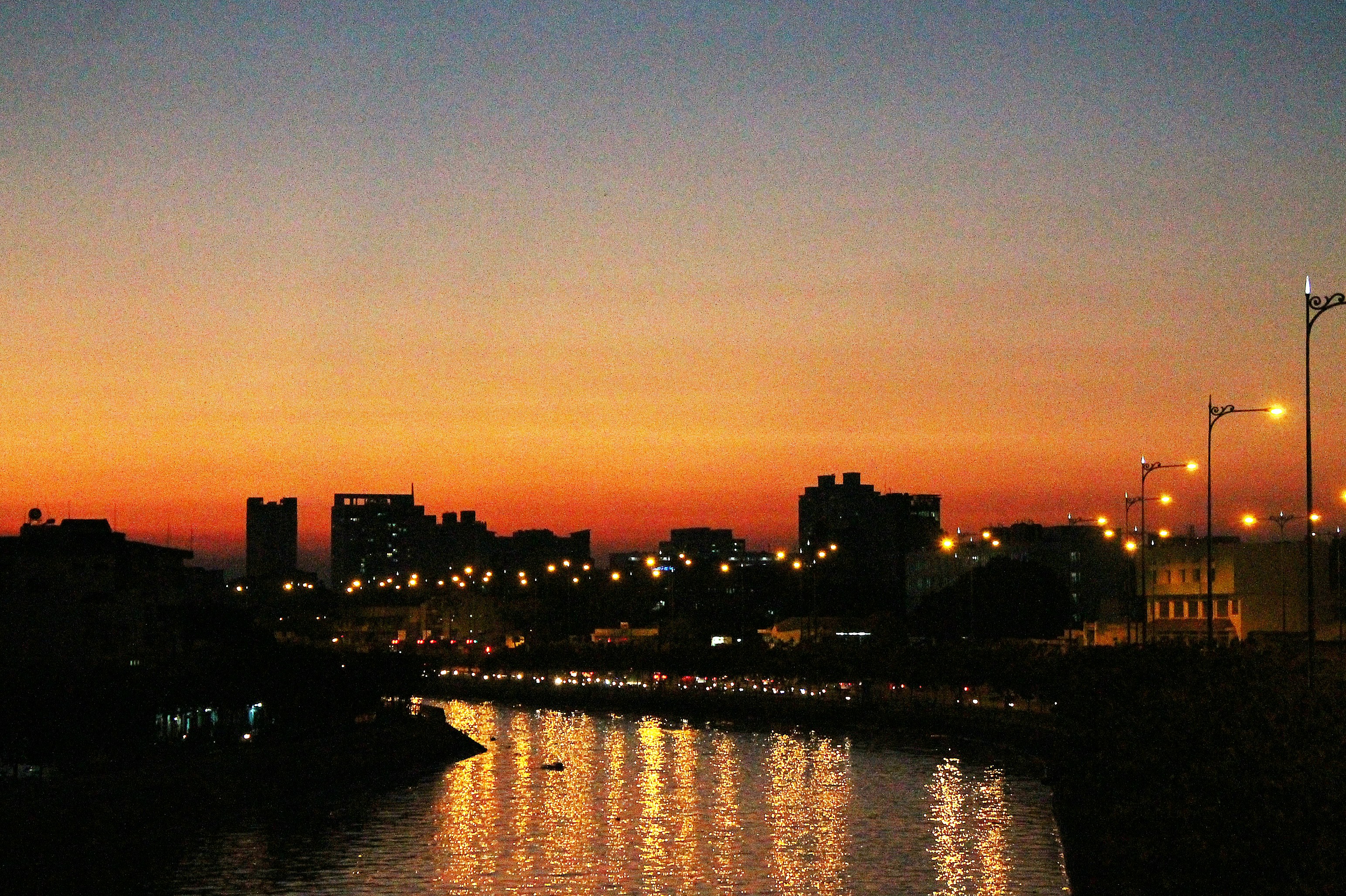 a city skyline at sunset