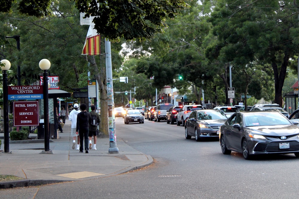 a busy street with cars and people