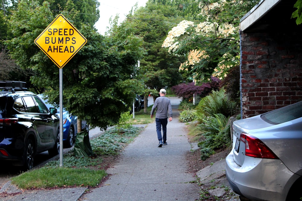 a man walking down a sidewalk