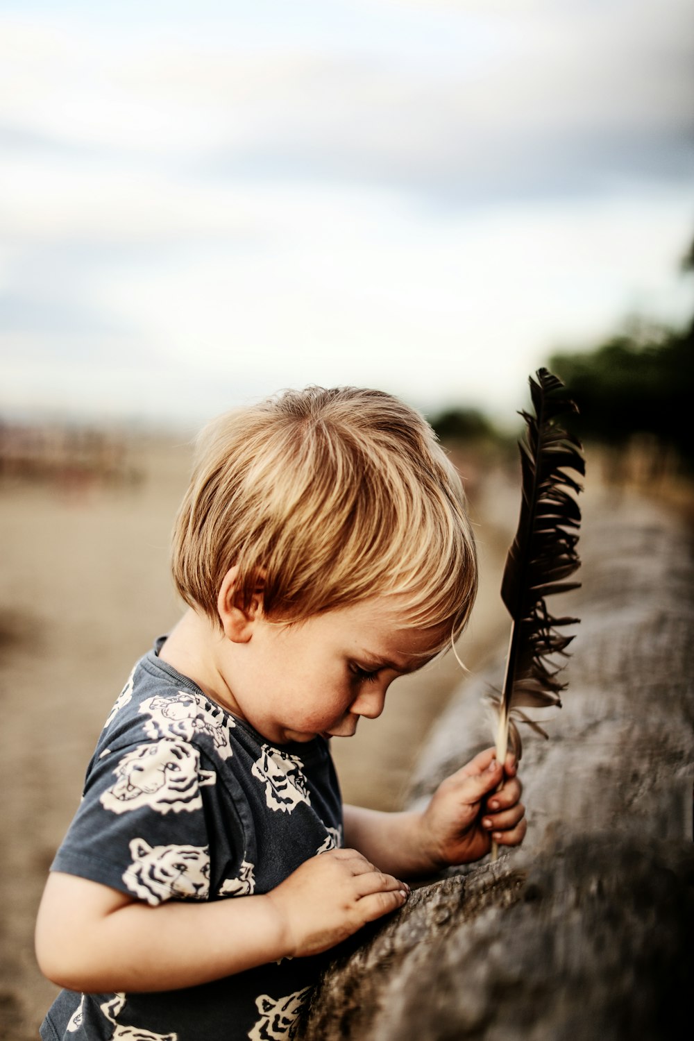 a boy holding a fish