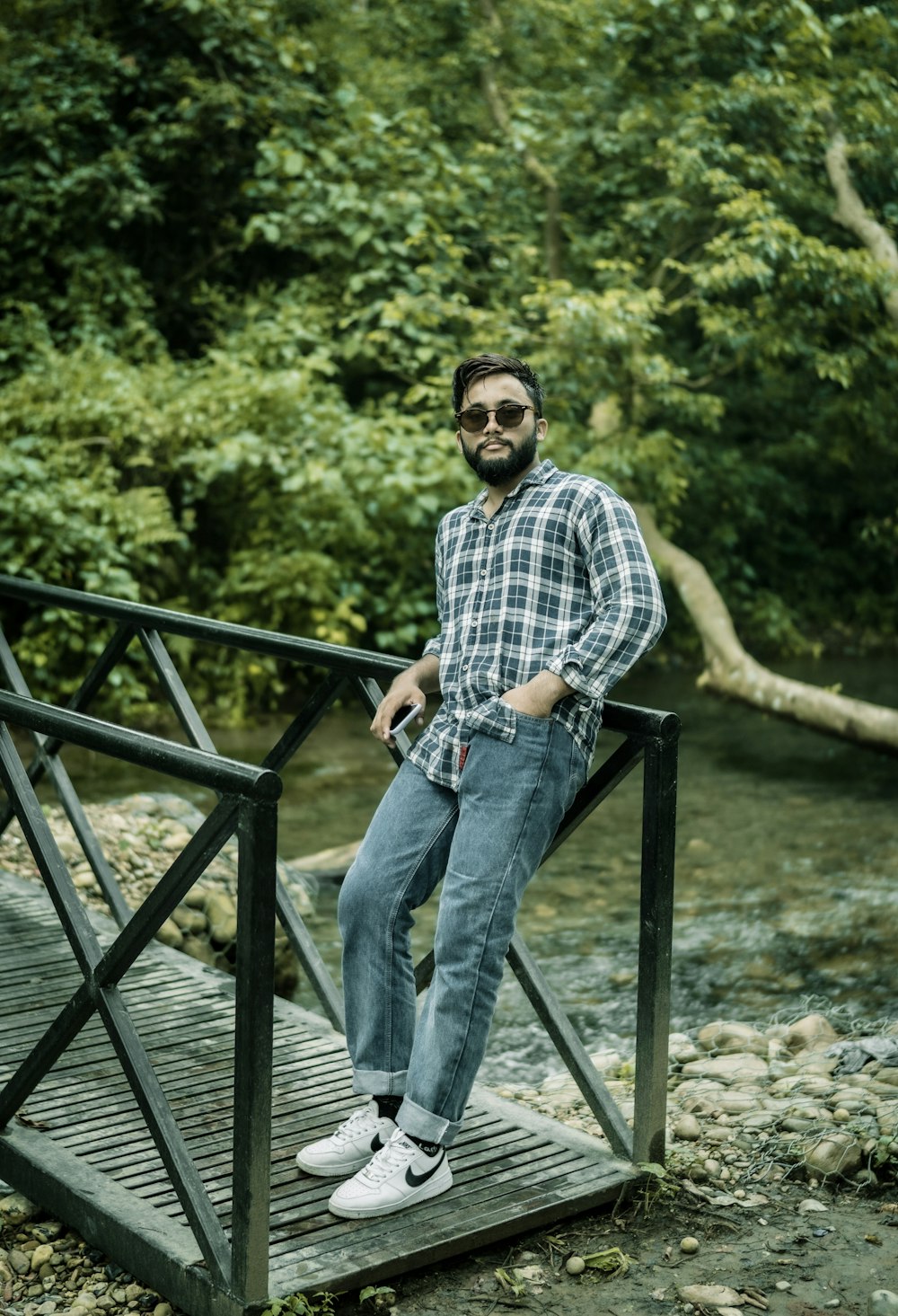 a man sitting on a metal railing