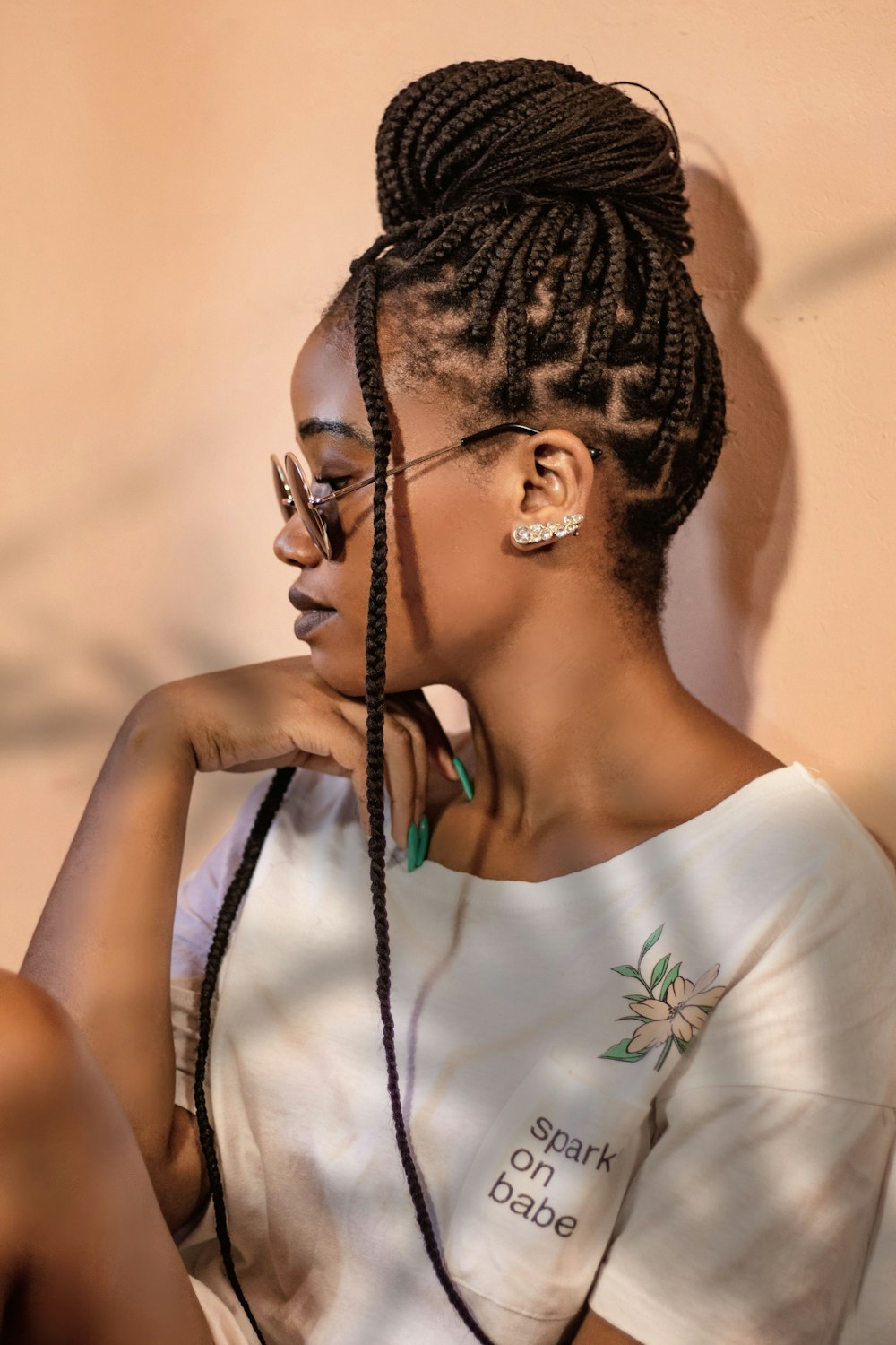 a woman with a braided haircut