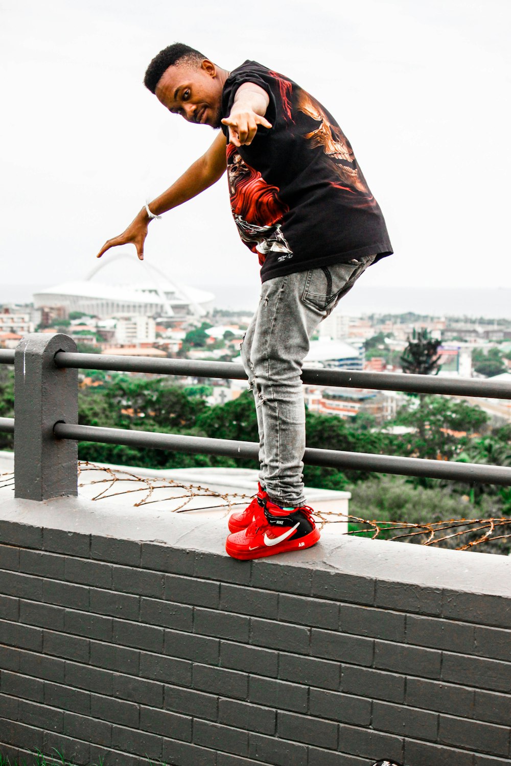 a man standing on a railing