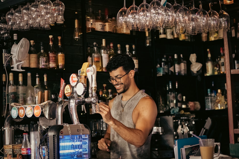 a man standing in front of a bar