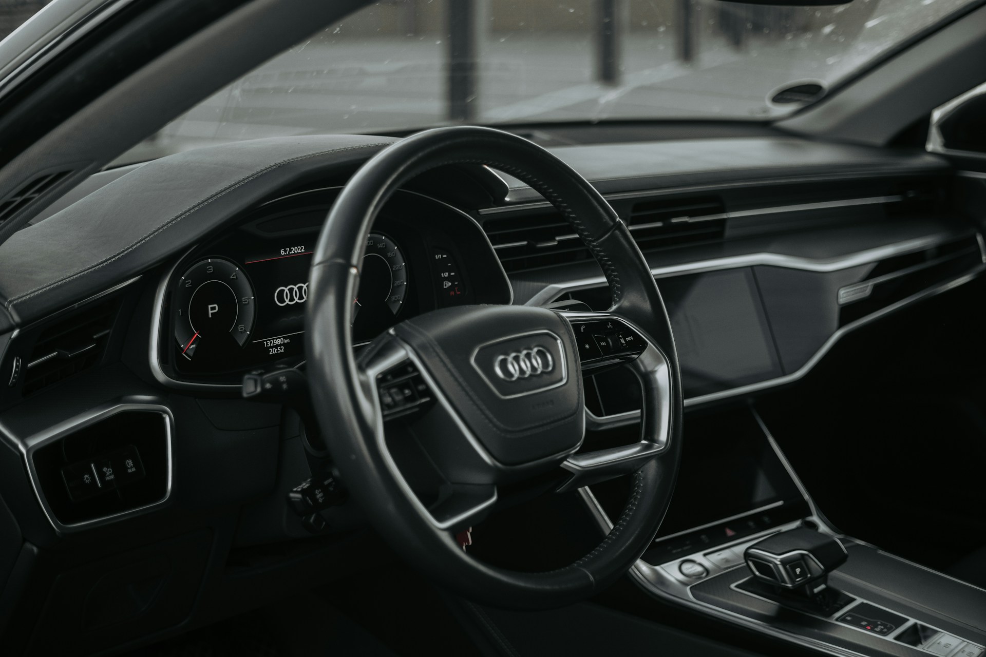 the steering wheel and dashboard of a car