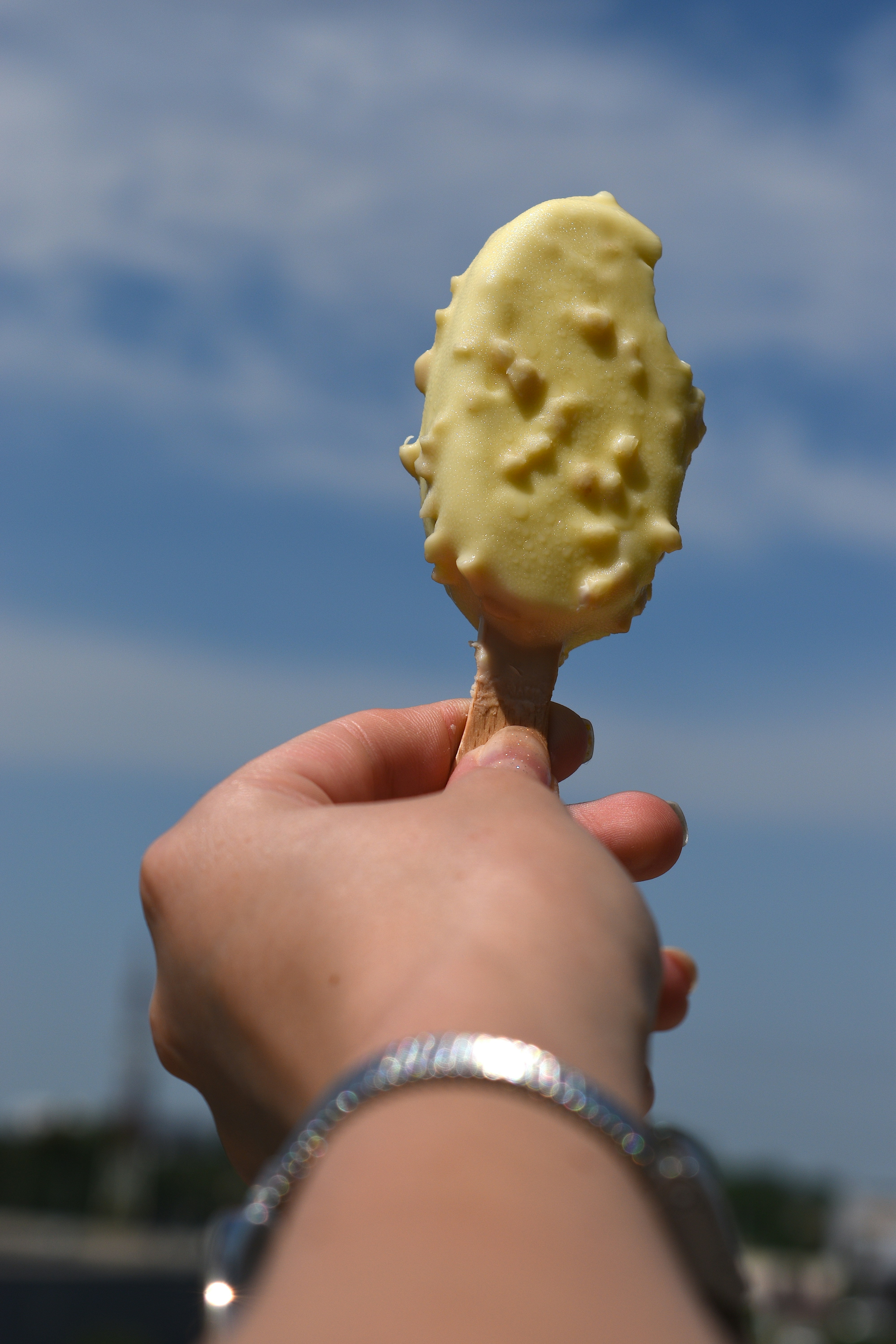 a hand holding a piece of food