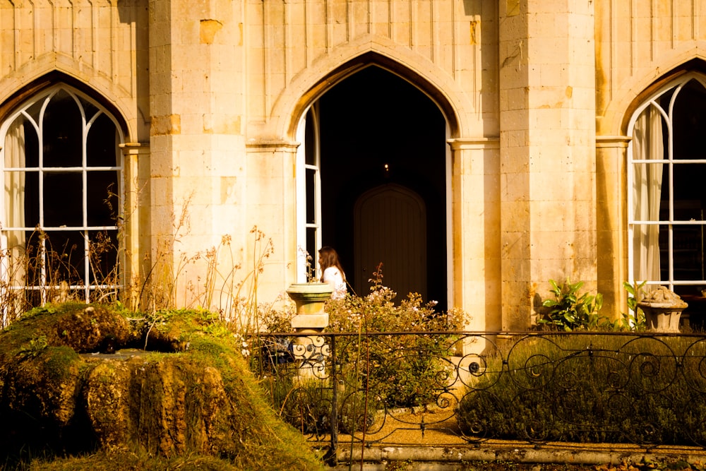 a person standing in a doorway of a building