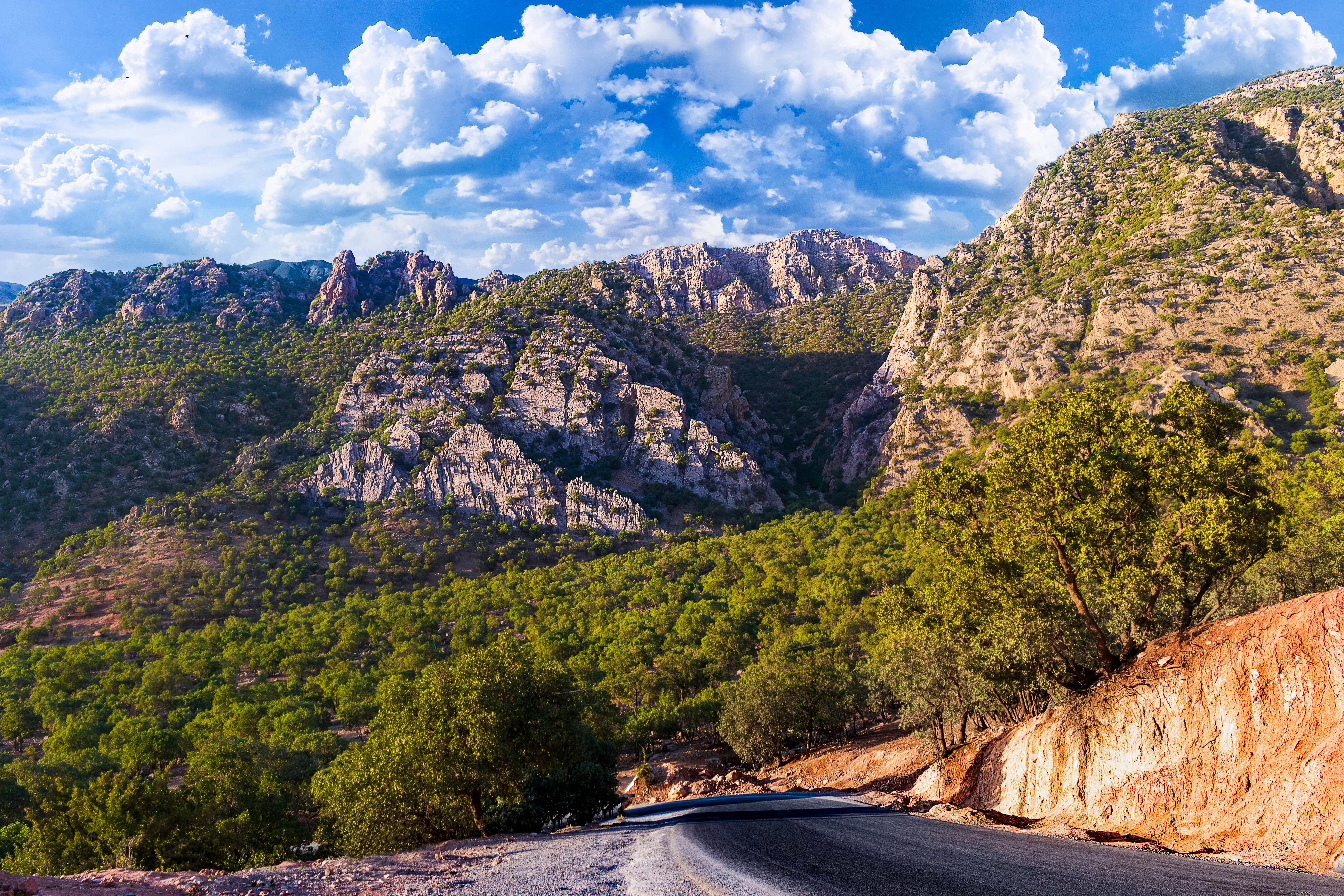 a road going through a mountainous region, love means ......