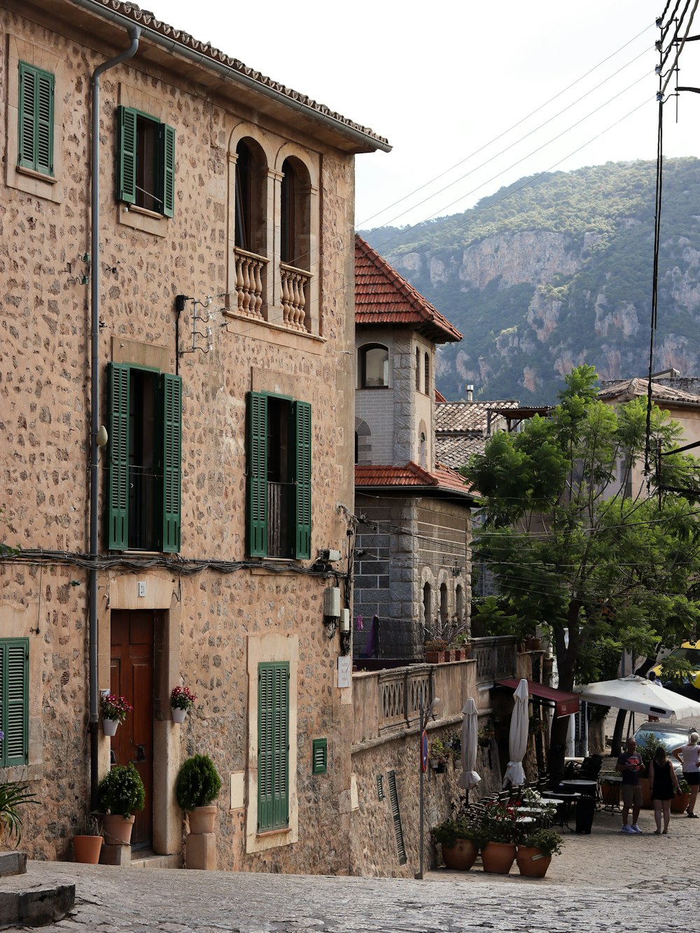 a building with a mountain in the background