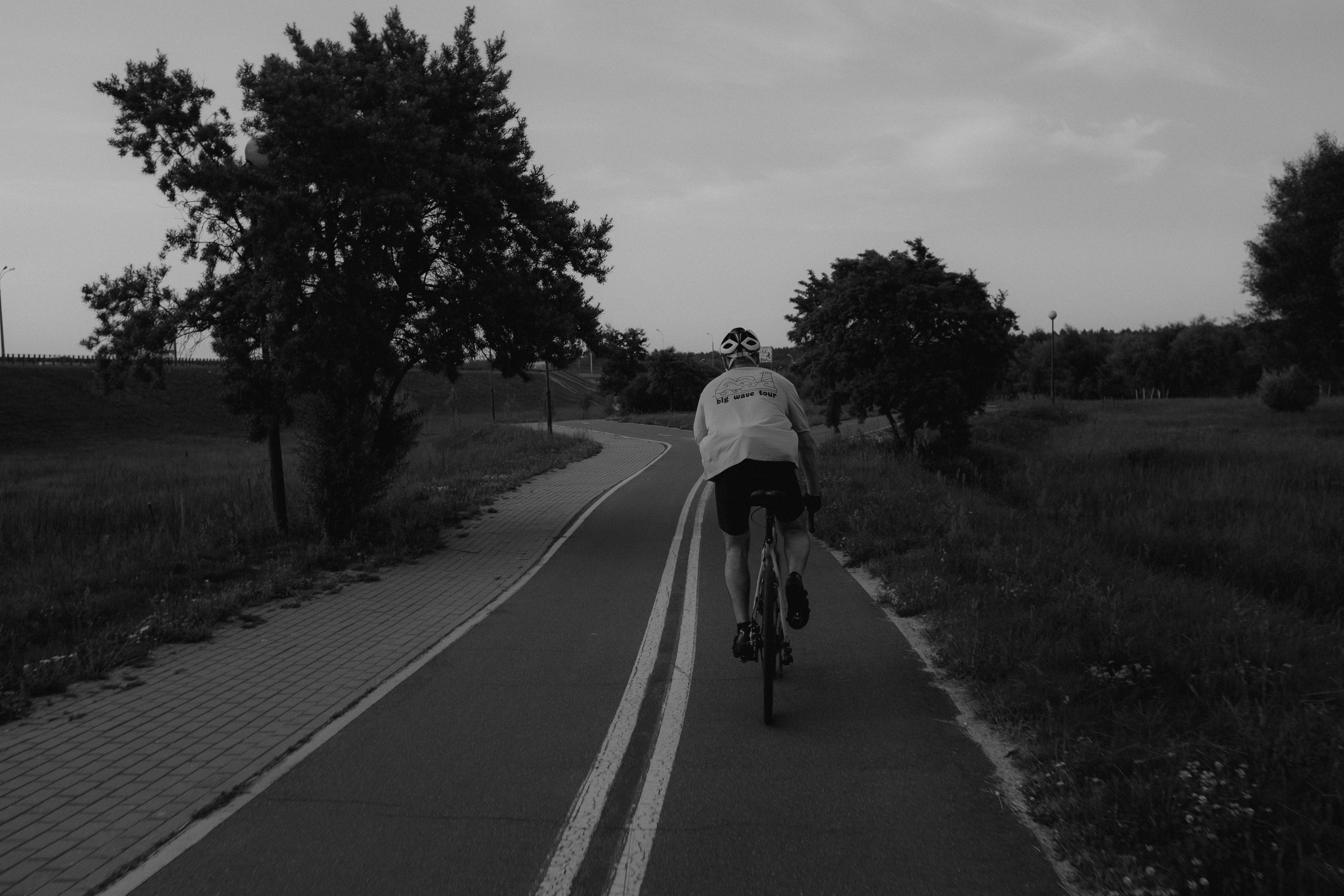 a person riding a bicycle on a road