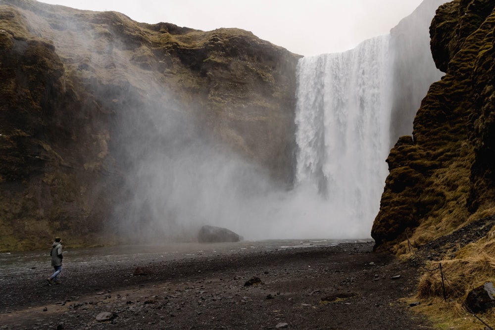 a man standing in front of Boiling Lake