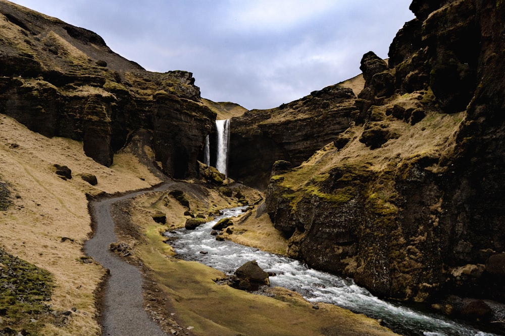 a waterfall in a rocky canyon