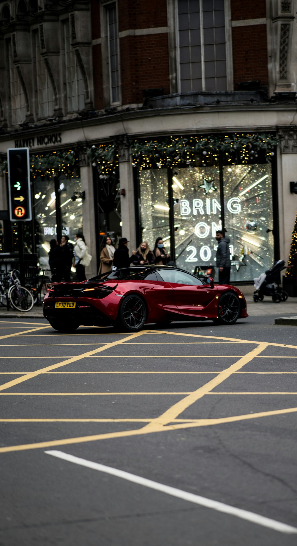 a red sports car parked outside a building