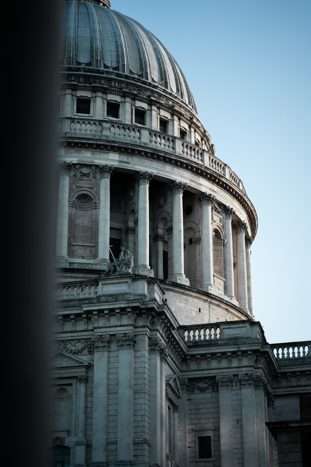 a building with a dome and columns