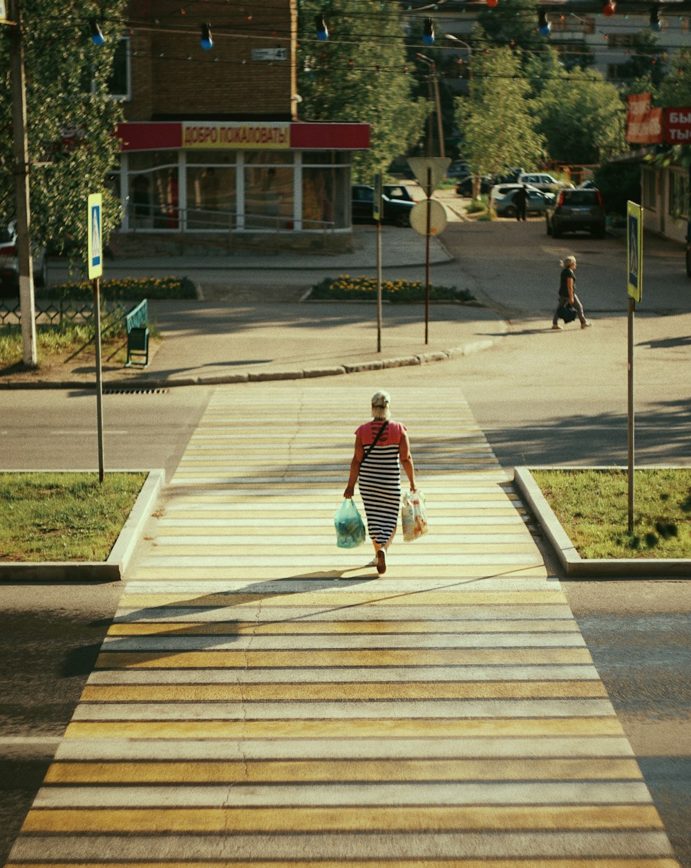 a person walking down a sidewalk