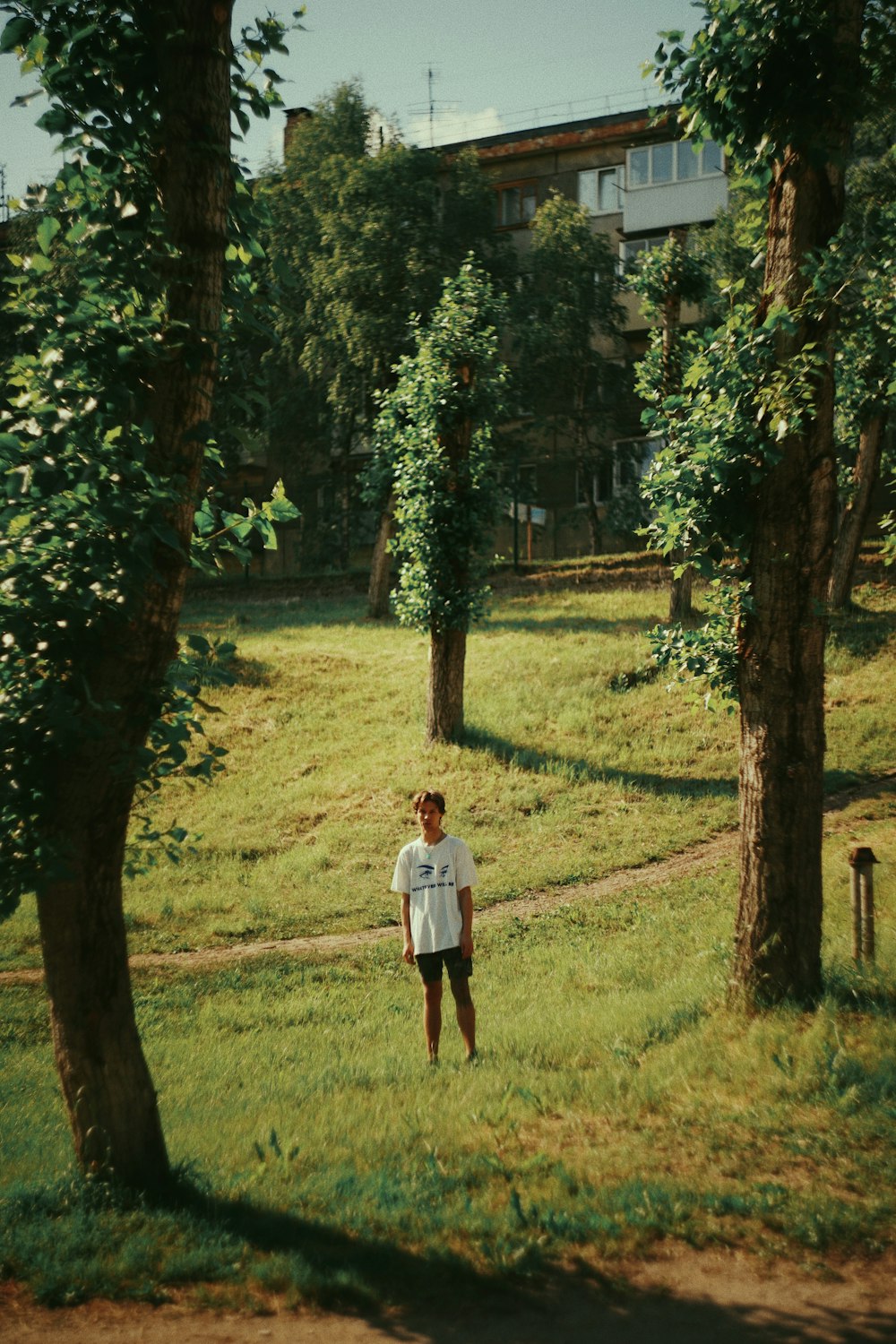 a person standing in a grassy area