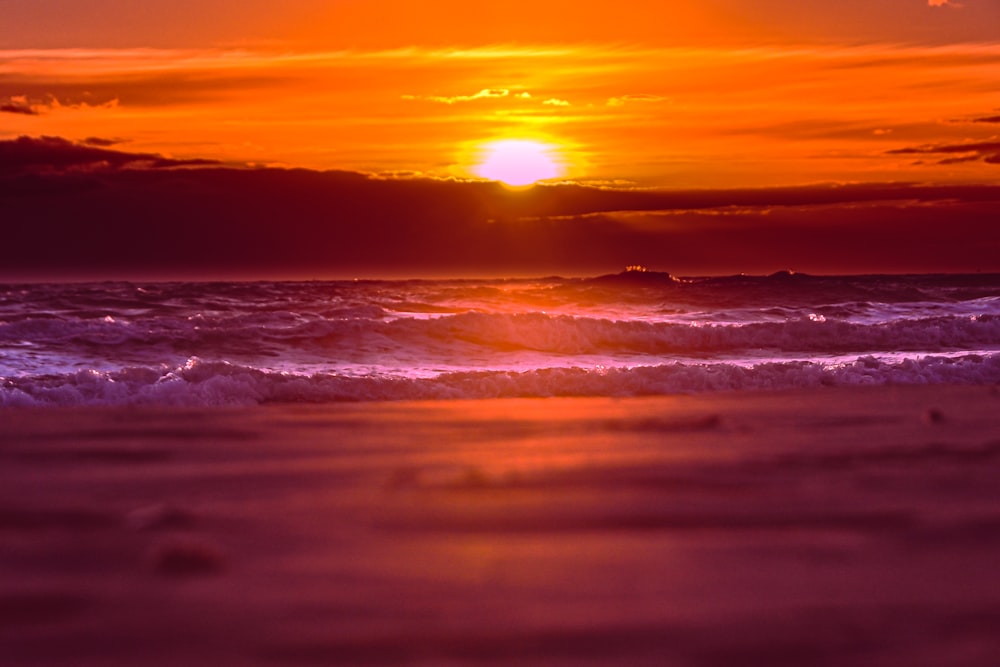 a sunset over a beach