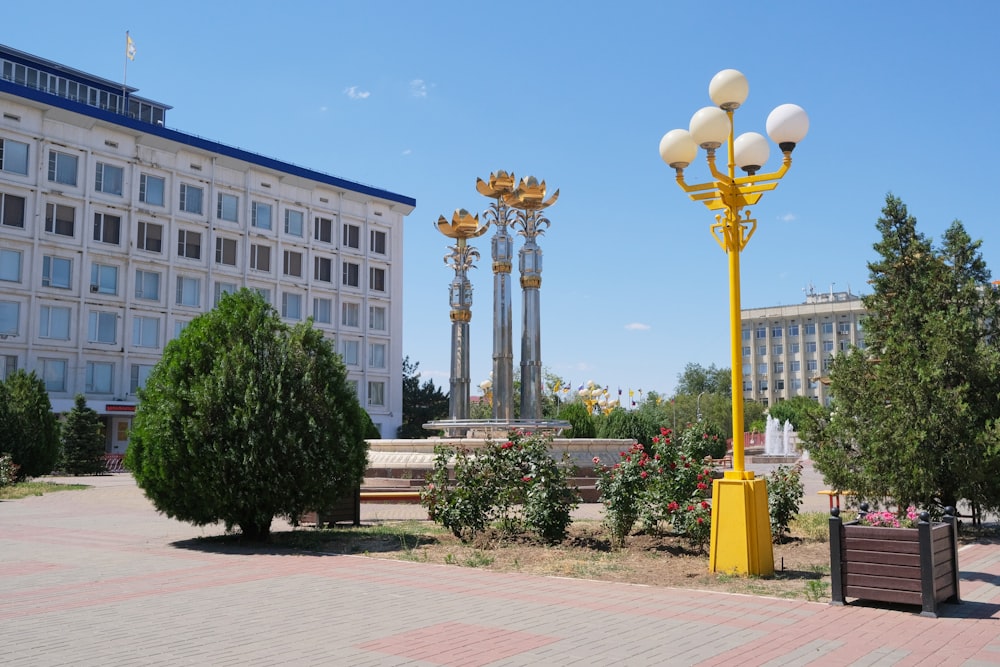 a yellow pole in front of a building