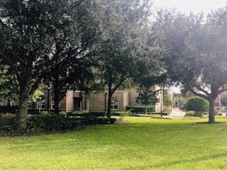 Image showing a clean and well-maintained green space around an office building.
