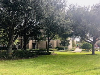 A well-maintained commercial property surrounded by green landscaping.