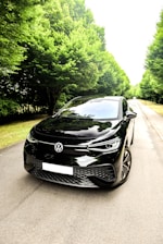 a black car parked on a road