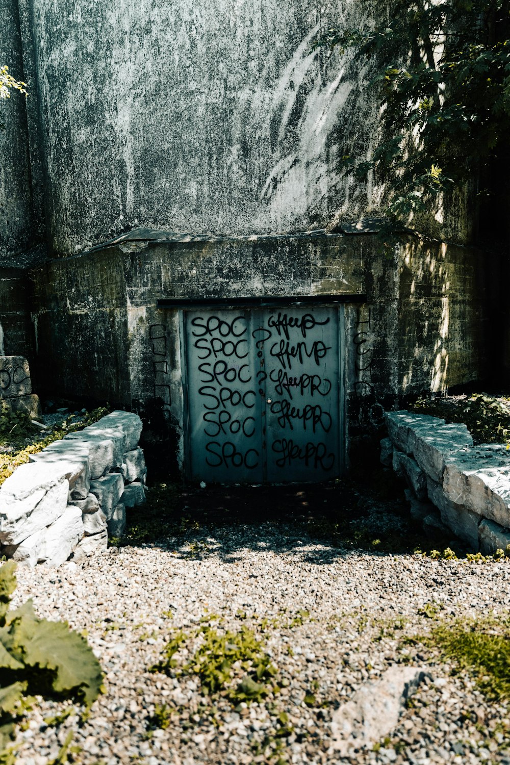 a stone monument with a sign on it