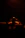 Smiling young man with headphones in a dimly lit room, suggesting a secret agent vibe.