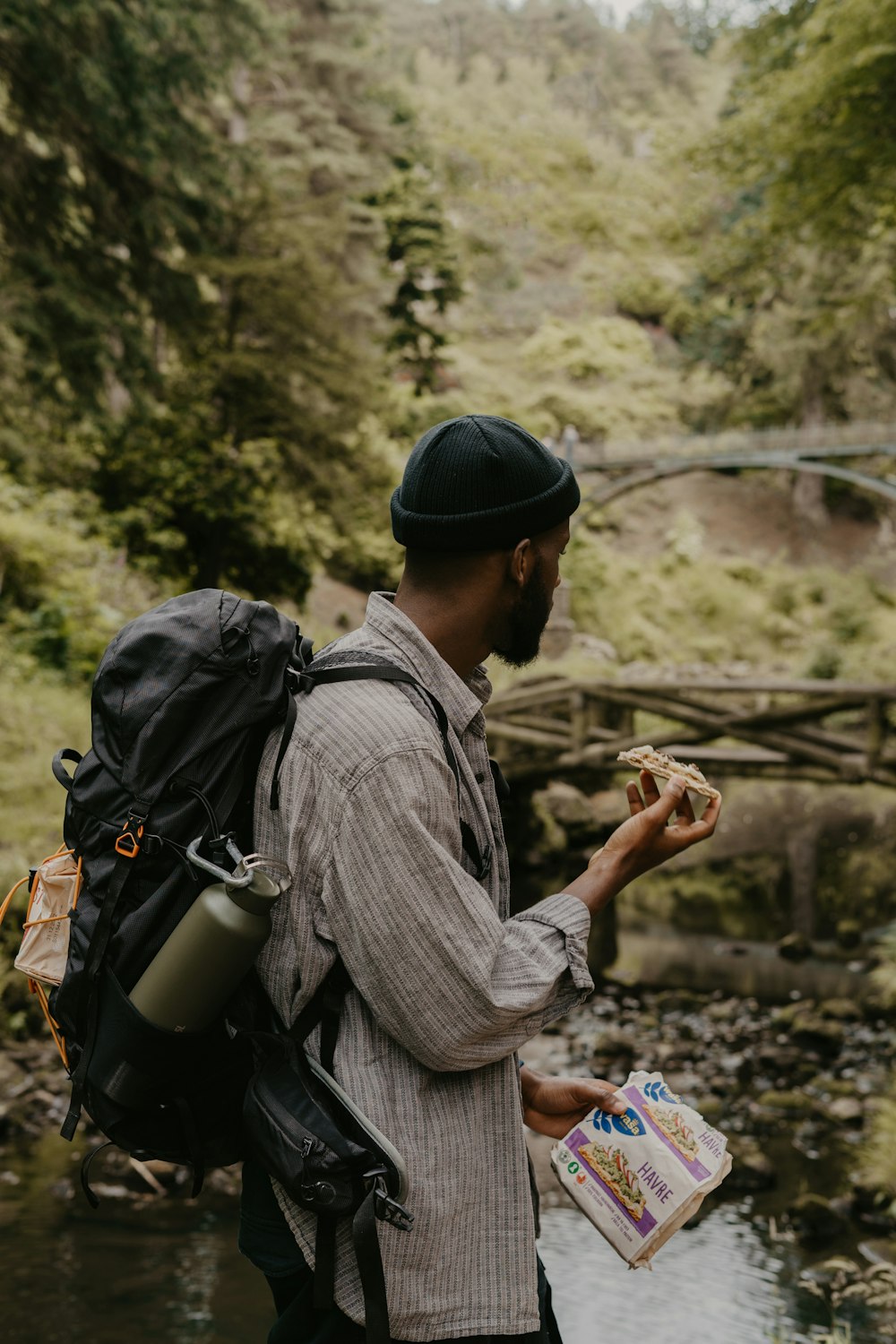 a person with a backpack looking at the phone