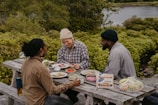 people eating at a picnic table