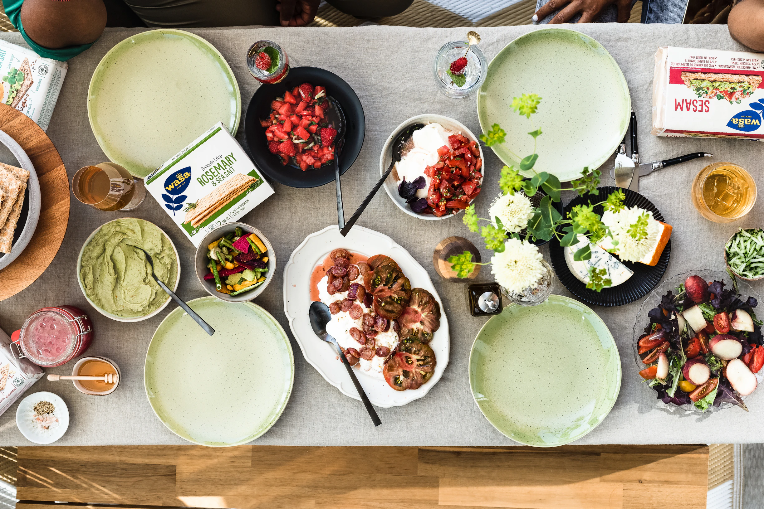 overhead view of a dining table with food ready to be shared