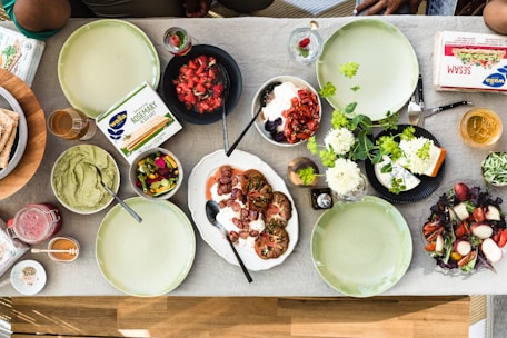 overhead view of a dining table with food ready to be shared