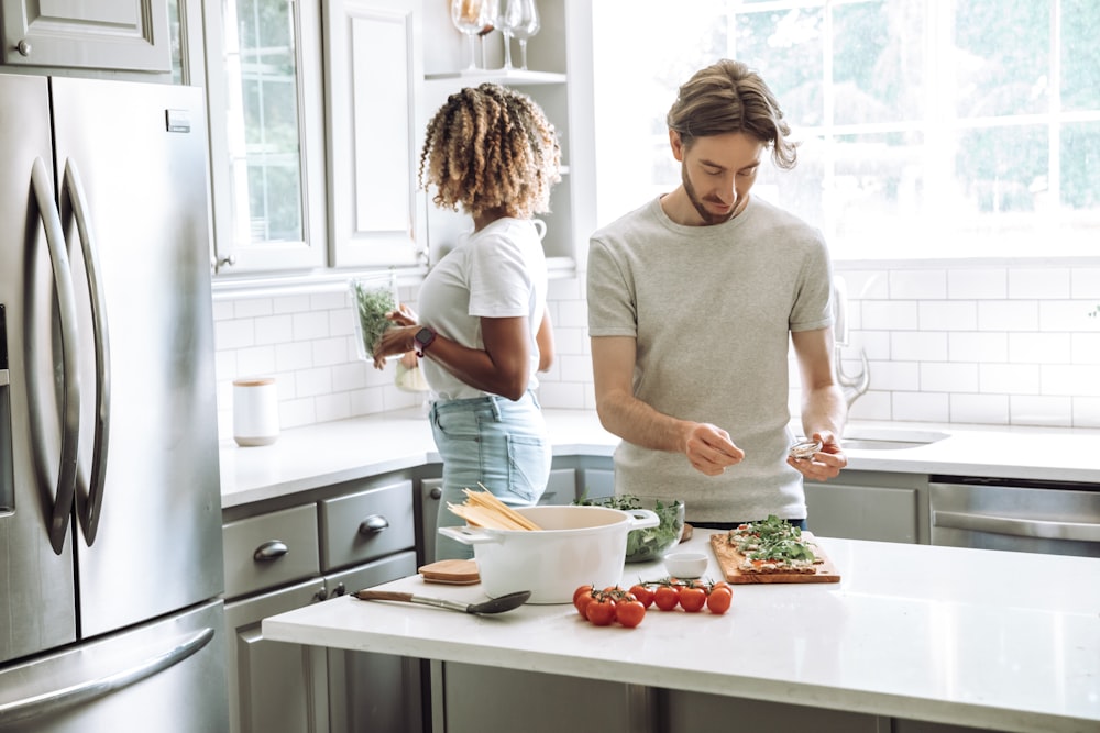 a person and a child cooking in a kitchen