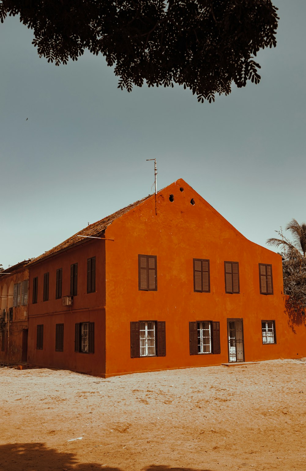 a building with a tree in the front