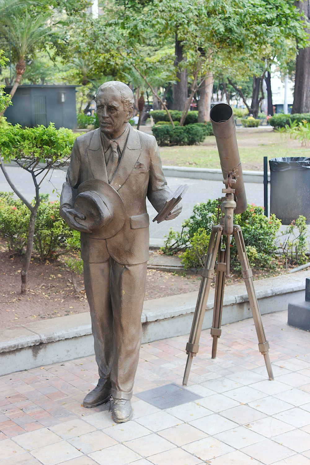 a statue of a person holding a hammer