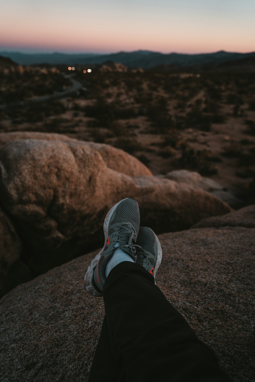 a person's feet on a rock