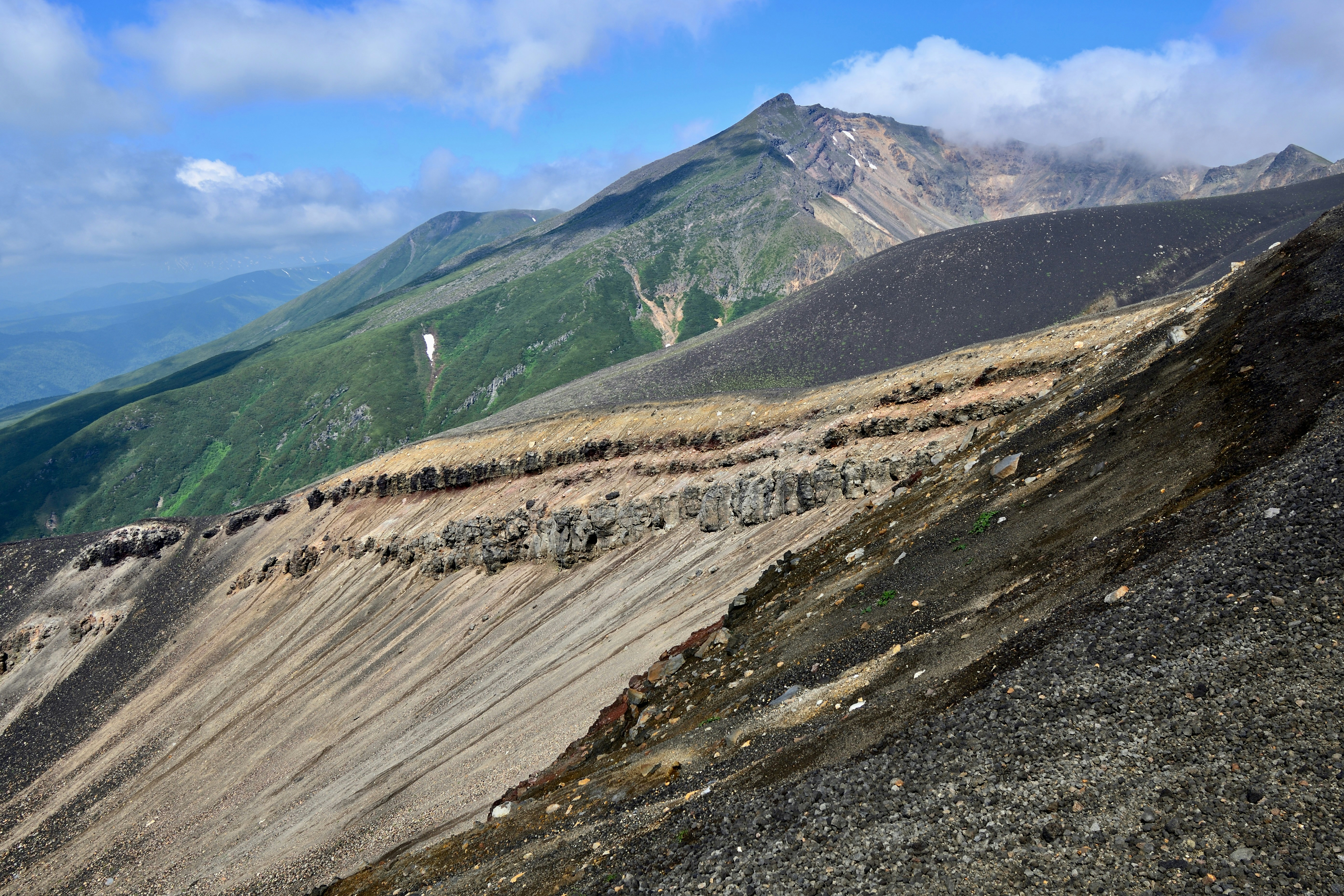 Biei, Japan - The crater and Mt. Biei-dake seen from the middle of Tokachi-dake.