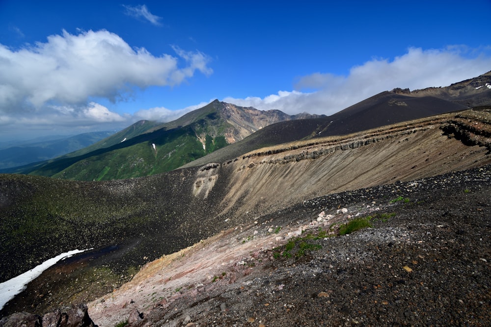 a dirt road in a valley