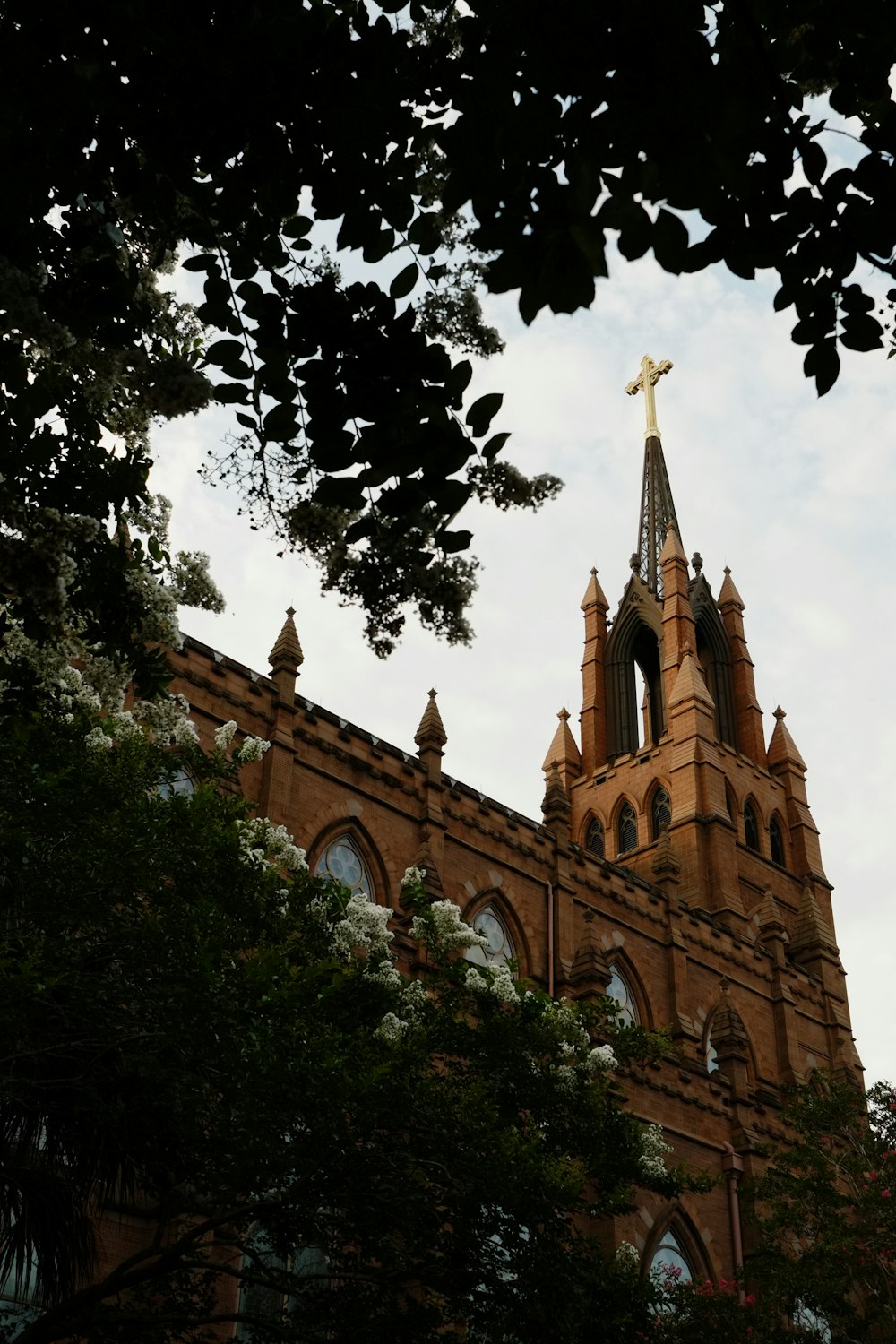 a large brick building with a tall tower