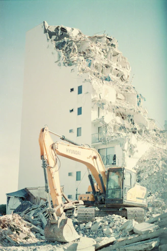 a large white building with a large pile of snow on the ground