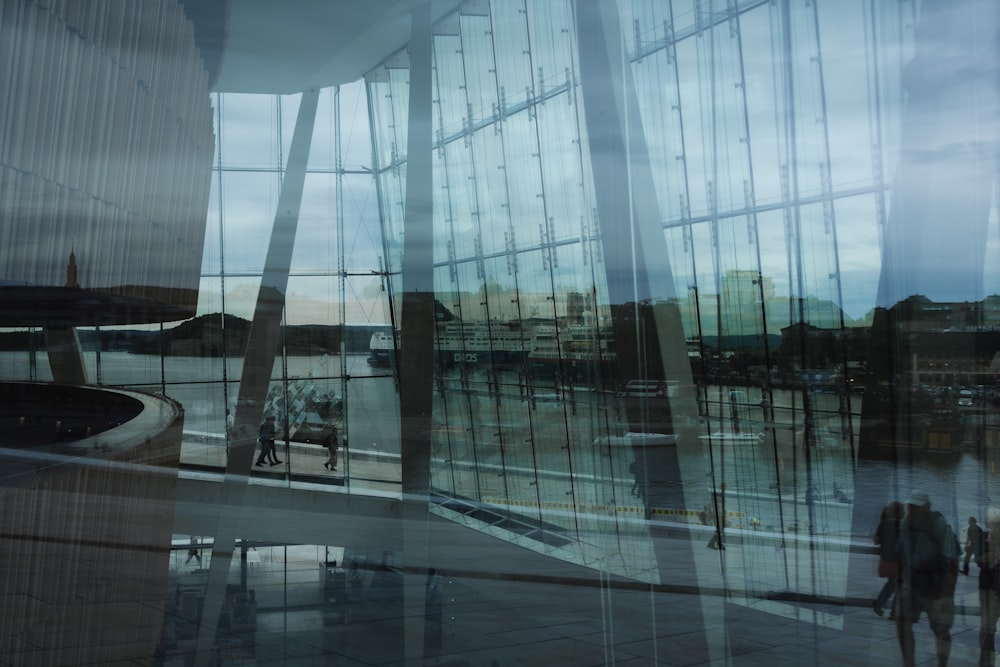 a large glass building with a large glass wall