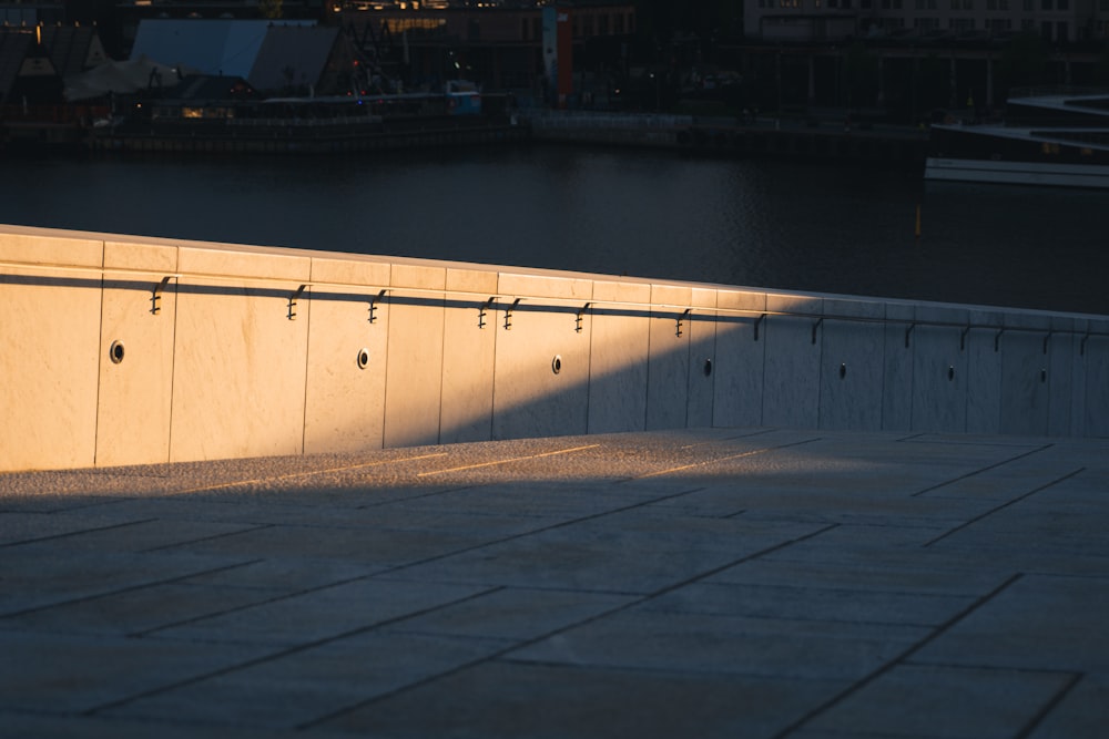 a concrete wall with a railing