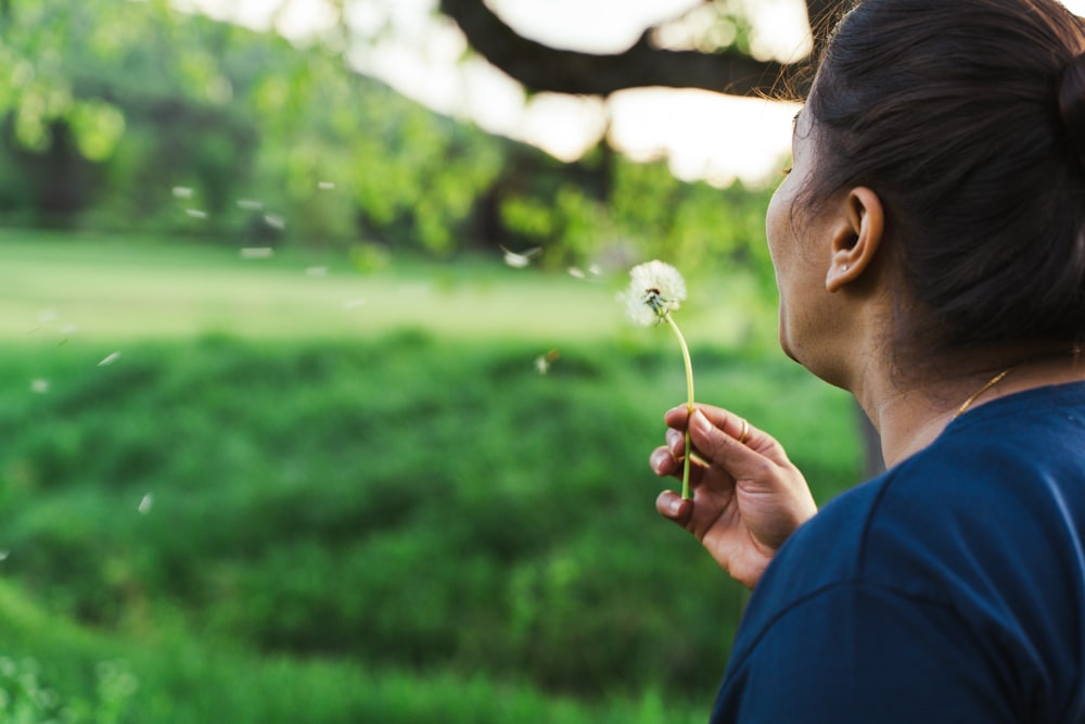 a person holding a flower