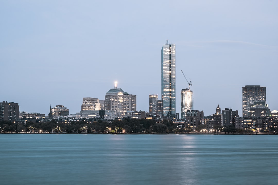 a city skyline across the water, Charles River and John Hancock Tower