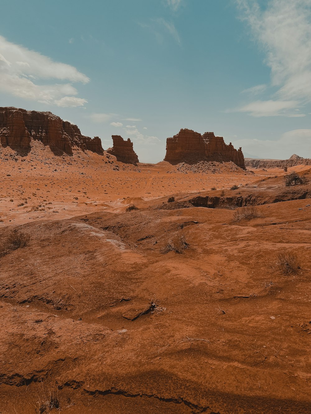a desert landscape with a few tall rocks