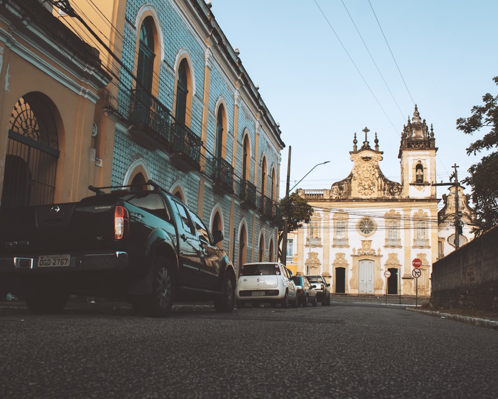 a group of cars parked on the side of a street