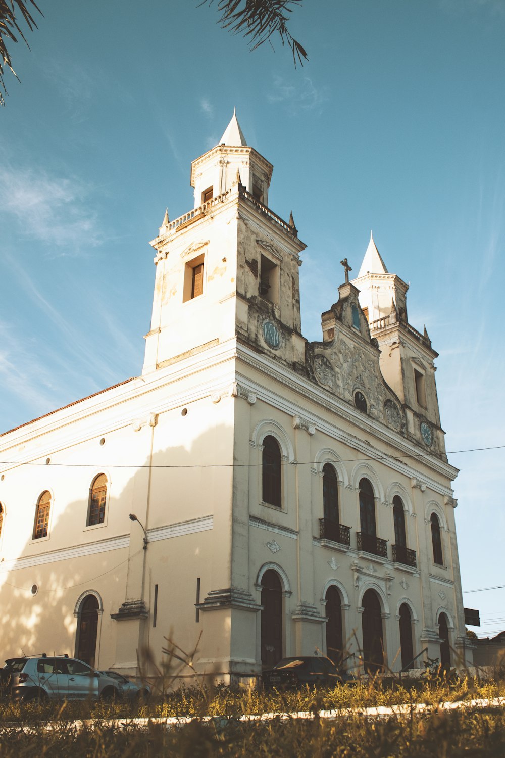 a white building with a clock tower