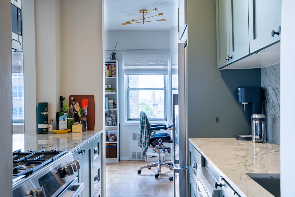 a kitchen with a chair and a table