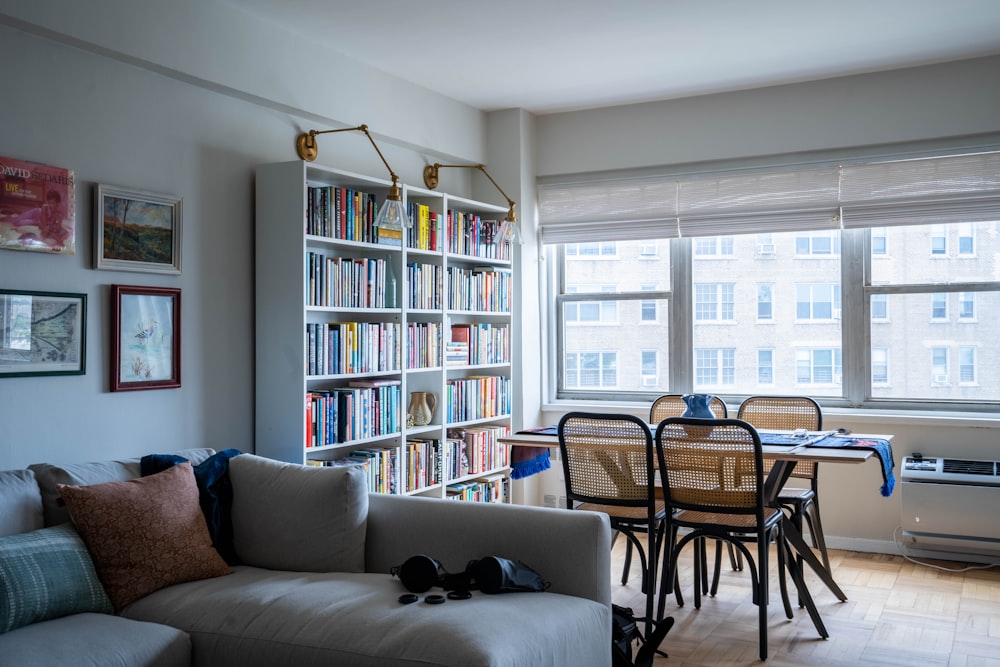 a living room with a bookcase and a couch