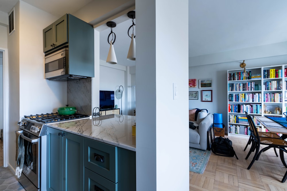 a kitchen with a bookcase